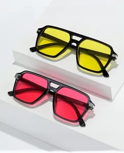 Detail of square frame fashion sunglasses with silver metal joints in black and grey