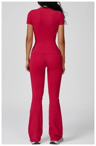 Back view of slim fit dark red yoga set featuring round neck top and flared high-waist pants