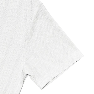 Close-up of white waffle texture fabric and sleeve stitching on men's V-neck summer shirt