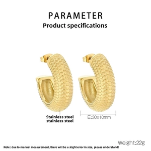 Detailed view of C-shaped stainless steel earrings with gold fish scale texture