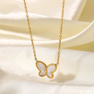 Macro shot of 14K gold-plated butterfly pendant with white mother of pearl inlay