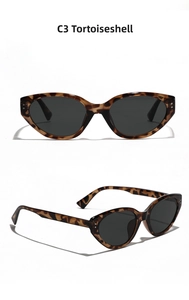 Detail view of tortoiseshell cat-eye sunglasses with metal rivets and grey lenses