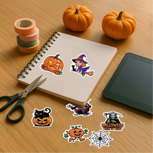 Cartoon Halloween stickers with pumpkin and witch motifs on a wooden desk setup