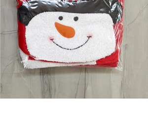 Close-up of a Christmas snowman toilet cover set folded in transparent packaging