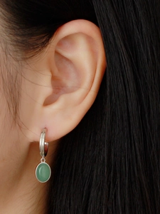 Close-up of S925 silver C-shaped hoop earring with a green aventurine oval pendant