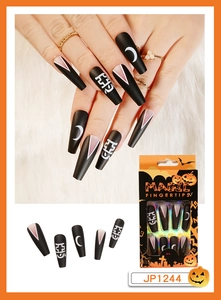 Detail of Halloween press on nails with black matte finish and moon cross patterns