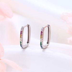 Close-up of S925 silver U-shaped hoop earrings with rainbow gradient cubic zirconia