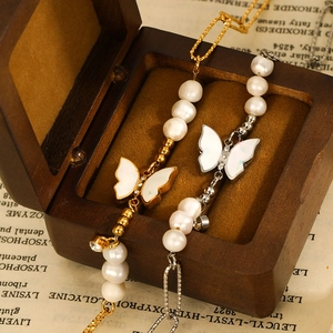 14K gold plated butterfly pearl bracelet featuring dainty metal chains and mother of pearl