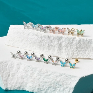 Detailed collection of butterfly cartilage studs with colorful zircon and opal inlays