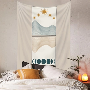 Detailed view of bohemian sun and moon tapestry hanging on a white brick bedroom wall