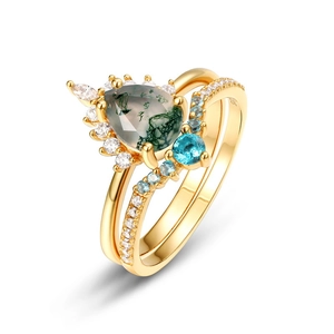 Detailed macro view of gold-plated 925 silver moss agate ring set with clear hallmark