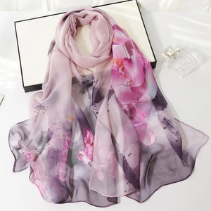 Elegant long silk scarf for women featuring light purple floral print on soft chiffon fabric