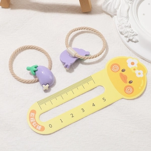 Close-up of cute purple eggplant hair ties with high-elastic beige braided rope for girls