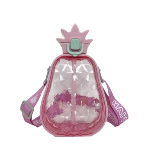Close-up of pink pineapple water bottle with adjustable strap and diamond texture