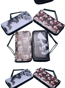 Detailed views of four vintage skull pattern long wallets with wrist straps and zippers