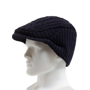 Winter navy blue cable-knit beret hat with ear protection for men in a 45-degree side view