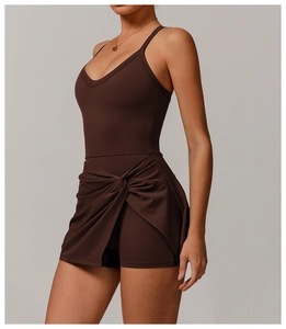 Detailed side view of deep brown tennis dress with twist hem and thin straps