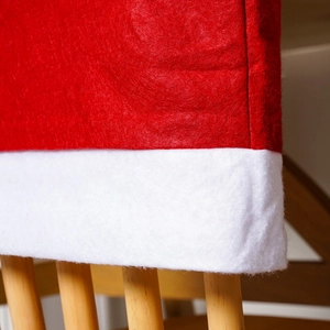 Close-up of the soft non-woven red felt fabric texture on a Christmas chair cover