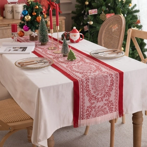 Christmas red jacquard table runner with tassels featuring festive holiday patterns