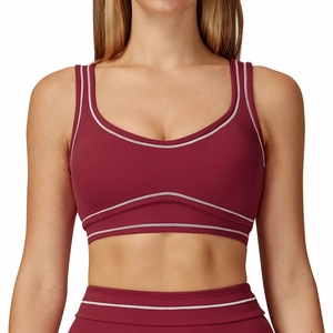 Burgundy high-stretch yoga sports bra with contrasting white seams and U-shaped back
