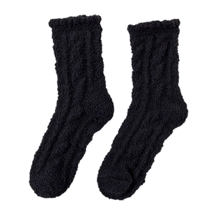 Thick black coral fleece thermal socks for women with a warm knitted texture on white background
