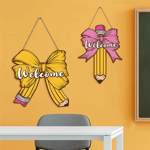 School welcome sign with yellow bow and cartoon pencil design for classroom wall decor