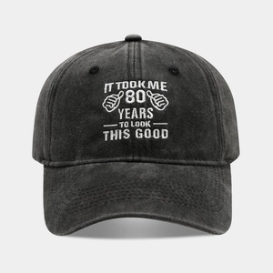 Detail of embroidered It Took Me 80 Years text on washed cotton baseball cap