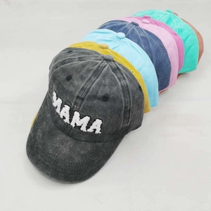 Washed cotton baseball caps with MAMA embroidery in various colors on white background