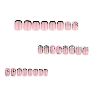 French black press-on nails set with y2k star and heart patterns on white background
