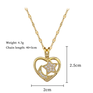 Detail of gold titanium steel necklace with moon star heart pendant and cubic zirconia