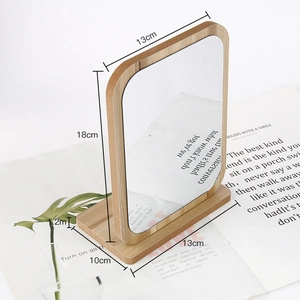 Detailed dimensions of the rotating rectangular wooden makeup mirror on a white table