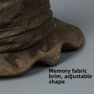 Detail of moldable brim on brown linen sun hat with textured fabric and memory wire