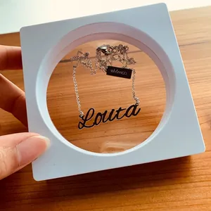 Custom stainless steel name necklace Loura in a white square 3D floating display box