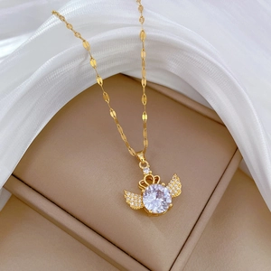 Elegant gold titanium crown wing necklace with round zircon in a premium velvet jewelry box