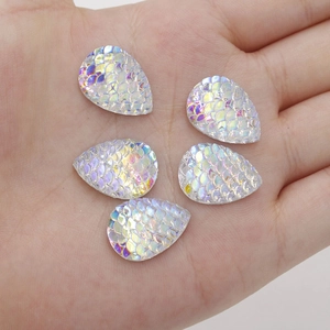 Close-up of 13x18mm AB color teardrop resin patches with iridescent fish scale texture