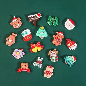 Detailed macro shot of 15 resin Christmas charms for DIY crafts and phone case decor