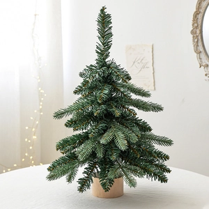 Mini green artificial PE Christmas tree with realistic pine needles in a wooden pot base
