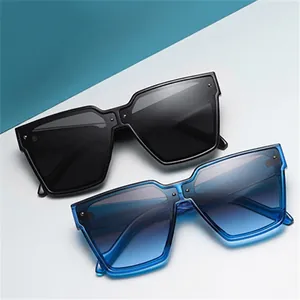Fashionable oversized square sunglasses with black and transparent blue frames for summer