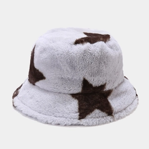 Close-up of thick plush faux fur bucket hat with large star pattern and soft texture