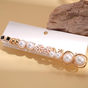 Set of 12 minimalist faux pearl and gold alloy stud earrings on a display card