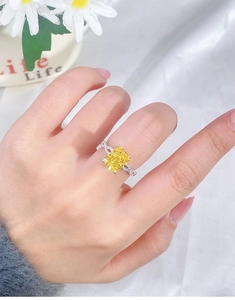 Detail of s925 silver ring featuring a large rectangular yellow ice-cut gemstone on hand