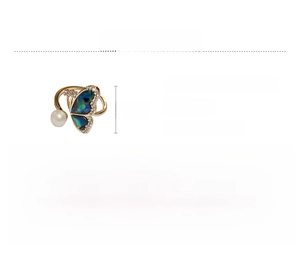 Macro shot of butterfly ring with shimmering shell wings and fresh water pearl detail