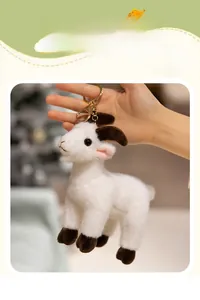 Detailed shot of a cute white plush sheep keychain with golden hook and soft texture