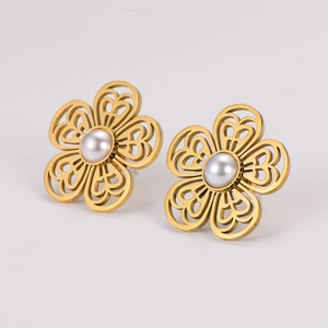 Elegant gold hollow flower stud earrings with central white pearls on white background