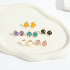 Colorful smiley face stud earrings set with gold trim in six vibrant enamel colors