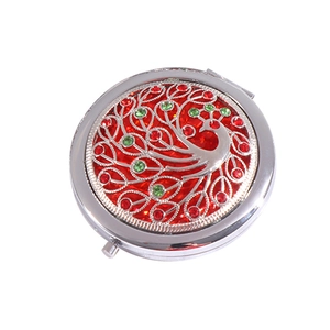 Vintage silver metal folding pocket mirror featuring hollow peacock design and jewels