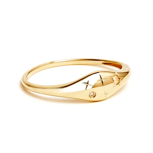 Macro detail of gold S925 sterling silver star sign ring with two sparkling zircons