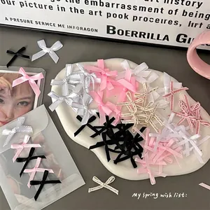 Assorted DIY ribbon bows in pink, black, and white for handmade jewelry and gift decor
