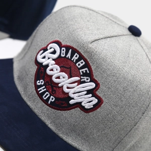 Close-up of vintage Brooklyn Barber Shop embroidery on high-quality baseball cap