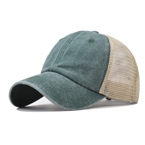 Detail of army green washed cotton baseball cap with breathable beige mesh back
